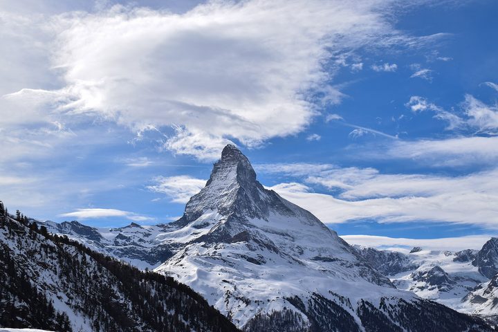 The reference photo: the Matterhorn under a blue sky with clouds